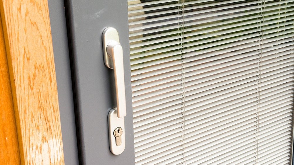Garden room door with integral blind