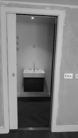 bespoke bathroom design with a pocket door for a garden room