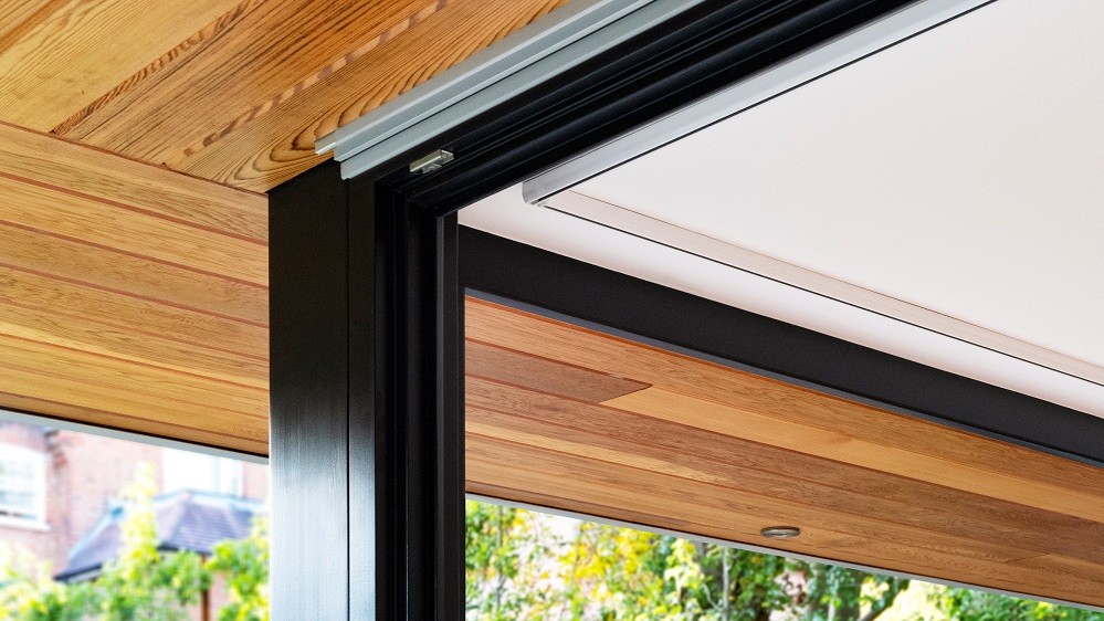 Corner feature and ovehang detail in a garden studio