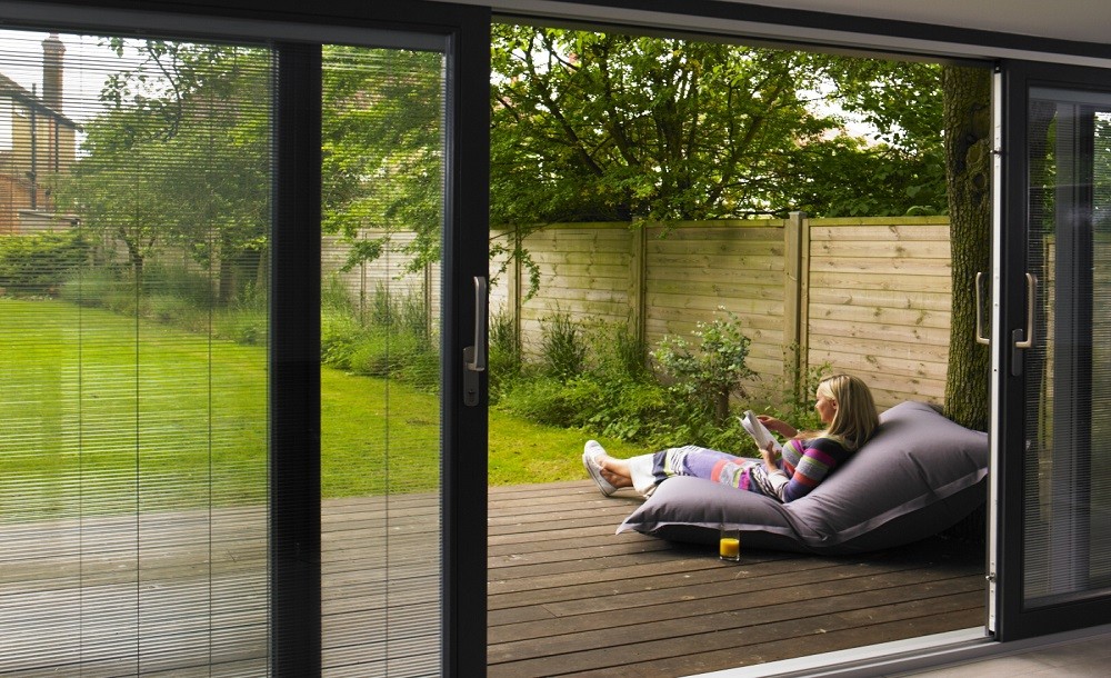 Sliding door with integral blinds for a garden studio by Rooms Outdoor