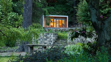 A bespoke holiday gym hidden in a woodland garden
