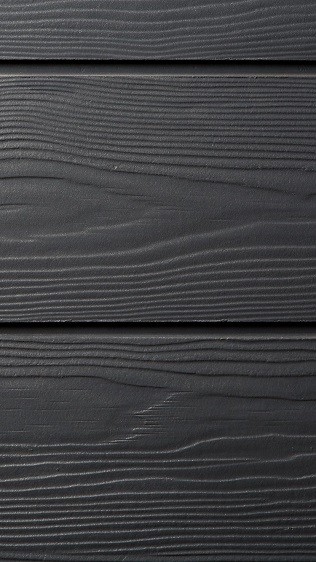 Composite cladding with a wooden effect texture for garden studios