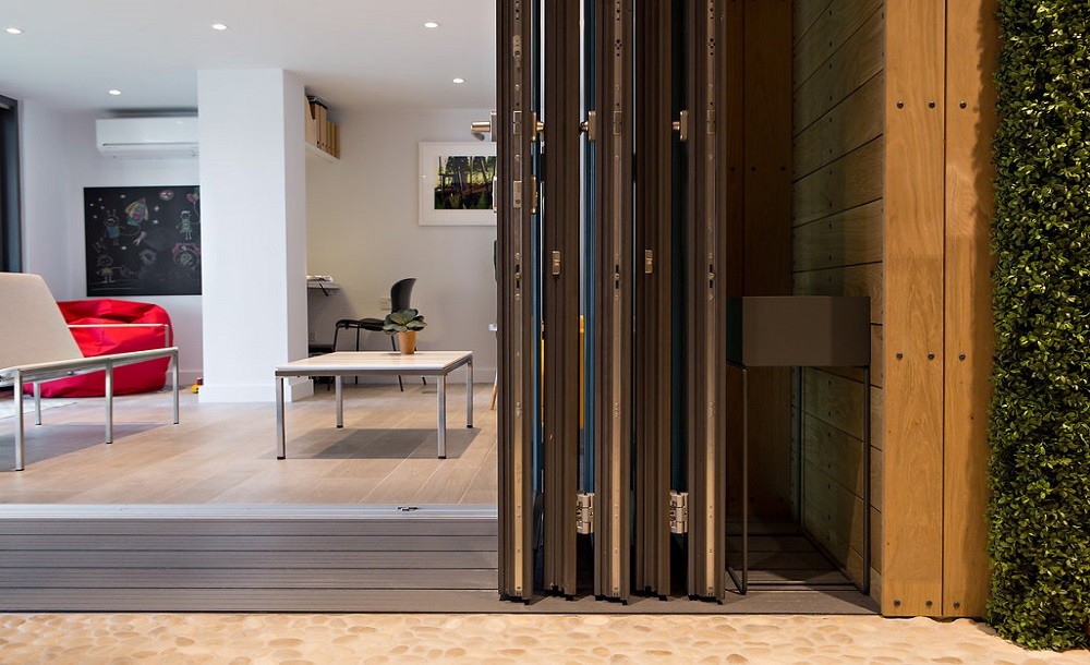 Bifolding double glazed doors for a garden studio by Rooms Outdoor